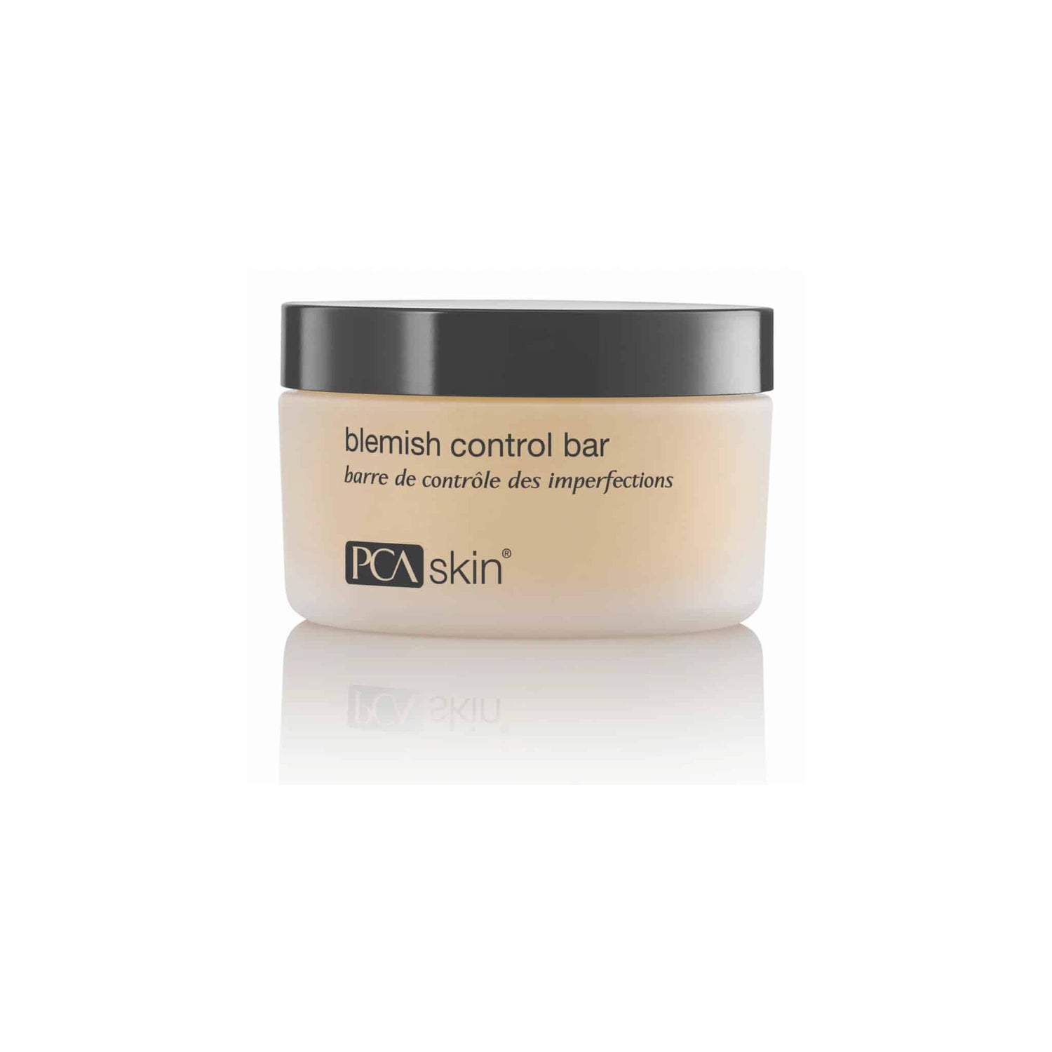 A small jar of Blemish Control Bar with a black lid and beige container. The label reads "blemish control bar" and "PCA Skin." Formulated with salicylic acid, it&