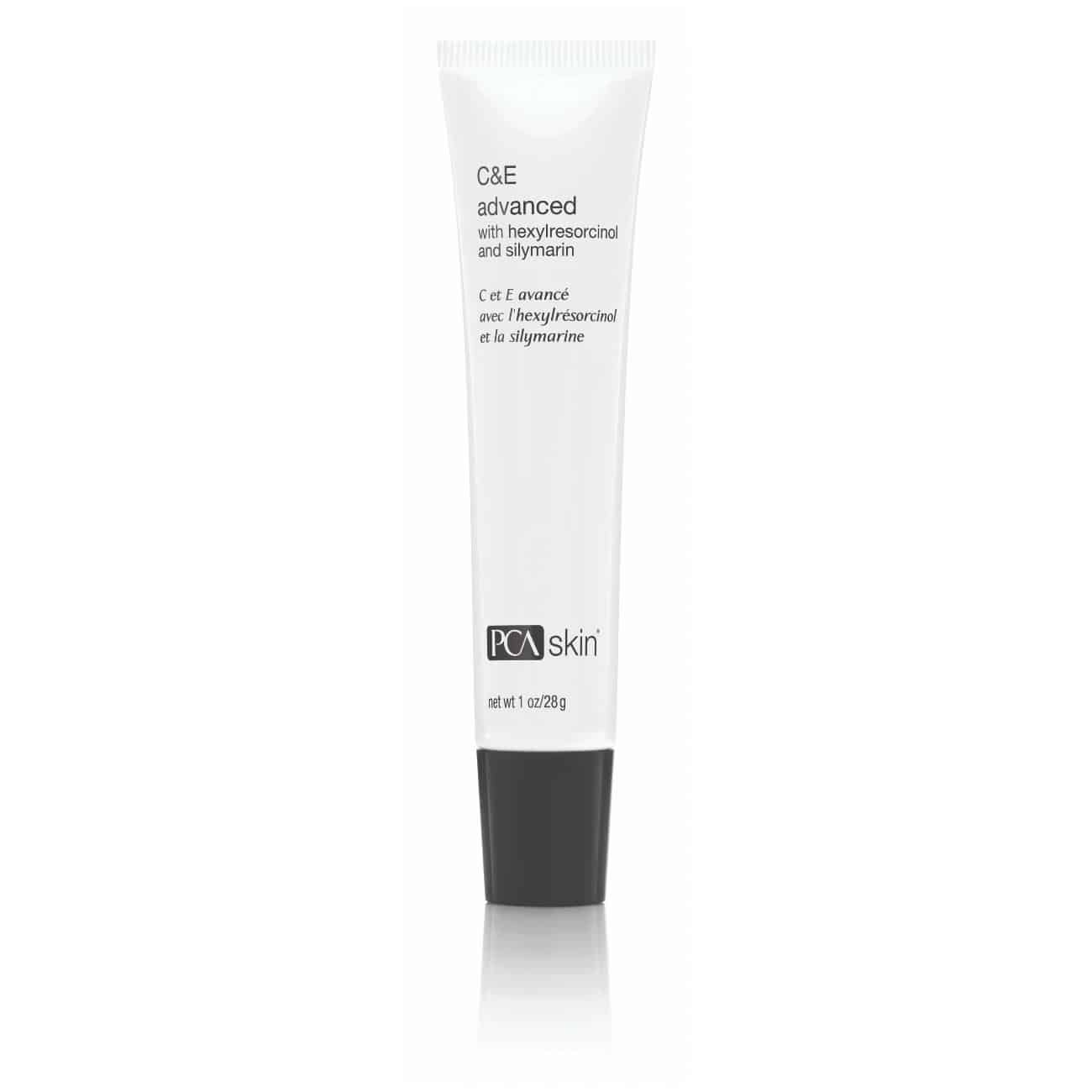 A white tube labeled "C&E Advanced" by PCA Skin, containing 1 oz (28g) and capped with black, stands upright against a plain white background. This antioxidant formula, enriched with Hexylresorcinol and Silymarin, is designed to reduce dark spots and provide anti-aging benefits.