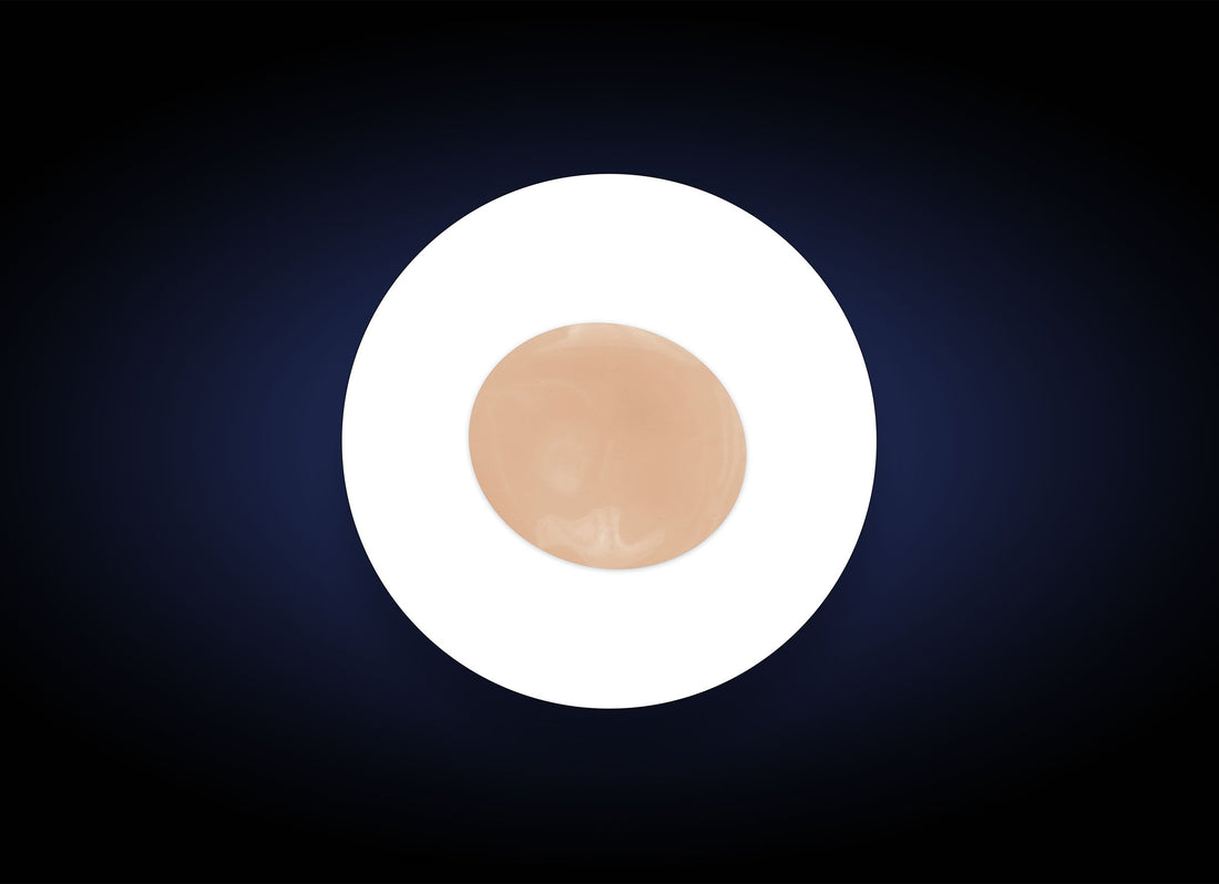 A round, white plate with a single C&E Advanced disc in the center, placed against a dark blue gradient background. The disc is smooth and shiny, resembling a flat, thin object infused with an antioxidant formula.
