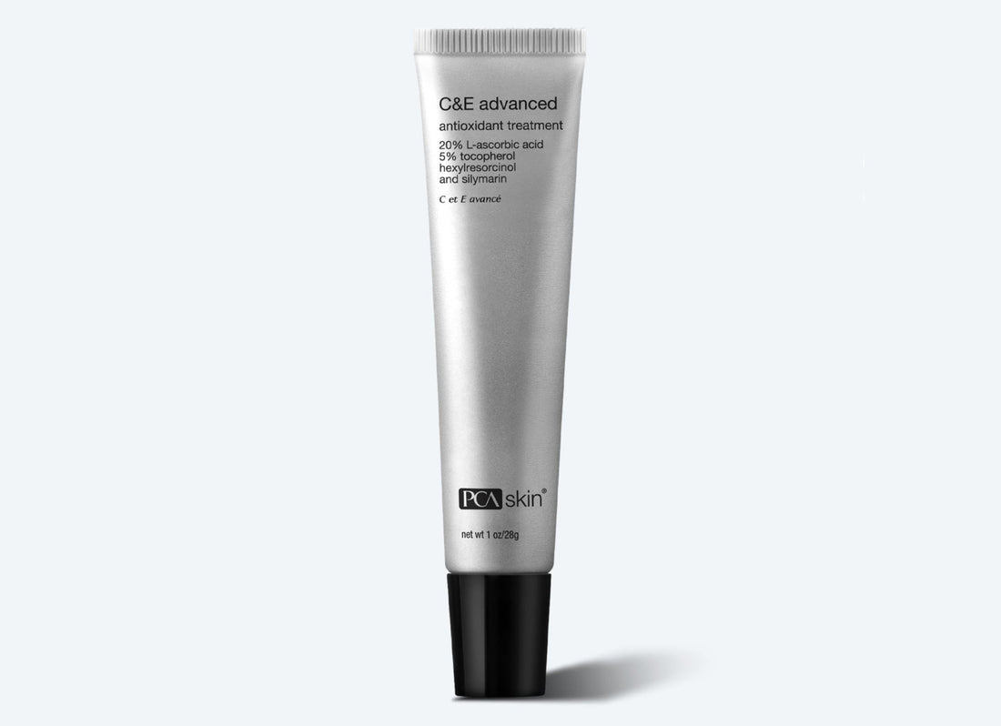 A silver tube of C&E Advanced against a light gray background. This potent antioxidant serum features black text detailing its ingredients, including 20% L-ascorbic acid, 5% tocopherol, hexylresorcinol, and silymarin. Perfect for reducing dark spots and signs of ageing.