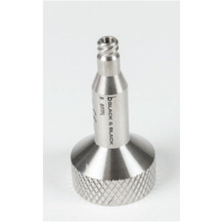 A metallic, precision-engineered Toomey 60cc to Luer Lock Syringe Connector, Stainless Steel with a threaded end and cylindrical body. The bottom of the Toomey 60cc to Luer Lock Syringe Connector, Stainless Steel is textured for grip. The words "B BLACK & BLACK" and "B MTRL" are inscribed on the body. The Toomey 60cc to Luer Lock Syringe Connector, Stainless Steel is displayed against a plain white background.