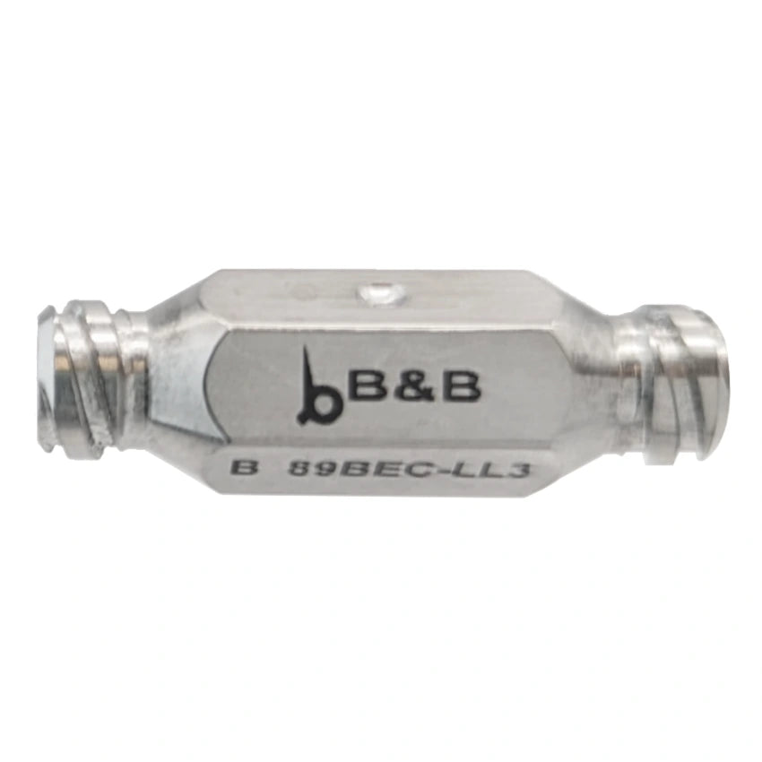 A close-up image of a B&B-branded Becker Luer To Luer Morselizer, 3mm. The connector is silver with a hexagonal body in the middle and threaded ends for secure attachment to coaxial cables, resembling the precision of a medical morselizing syringe.