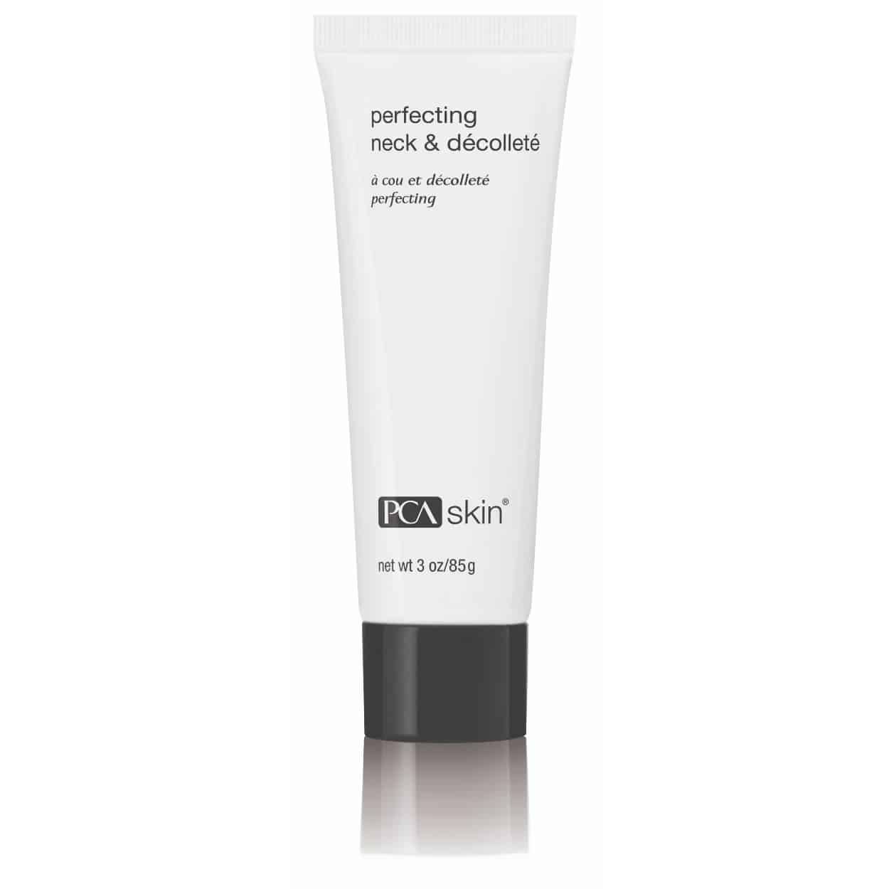 A white tube of &quot;Perfecting Neck &amp; Décolleté&quot; brand cream, targeting uneven skin tone and sagging skin, marked with a net weight of 3 oz/85g. The text on the tube mentions &quot;à cou et décolleté perfecting.&quot; The tube has a black cap at the bottom.