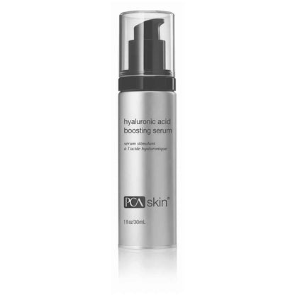 A silver cylindrical bottle with a black pump top, labeled &quot;Hylauronic Acid Boosting Serum&quot; by PCA Skin. Containing 1 fl oz (30 ml) of anti-aging serum, it features text in English and French. The design is minimalistic with a clean, clinical appearance, emphasizing hydration.