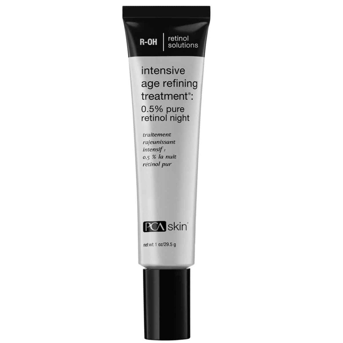 A black and white tube labeled &quot;Intensive Age Refining Treatm.: 0.5% pure retinol night&quot; from PCA Skin. This anti-aging treatment, weighing 29.5 g, features a black cap and the branding &quot;R-OH retinol solutions&quot; at the top. The text is in both English and French.