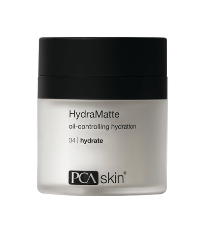 A 50-gram jar of HydraMatte. The jar features a matte black screw-on lid with &quot;HydraMatte&quot; written prominently on the front, followed by &quot;oil-controlling hydration&quot; for a clear complexion and the product&