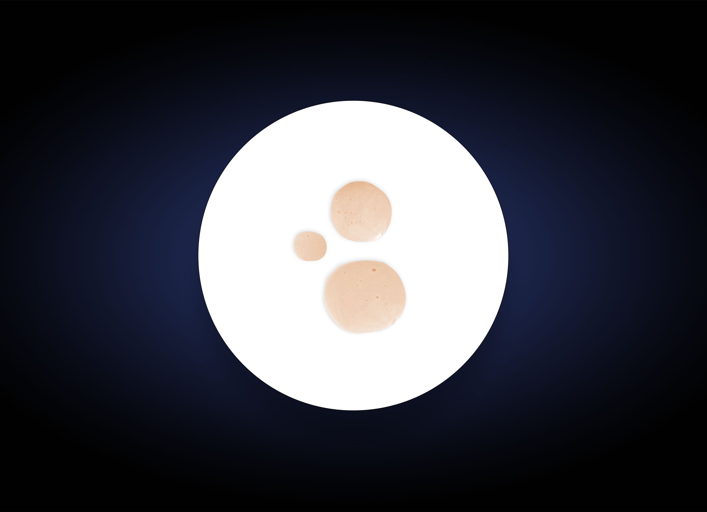 A white plate with three dollops of light brown sauce in varying sizes, arranged close together. The plate is centered on a dark blue gradient background, reminiscent of the gentle application of Hydrating Toner Spray providing antioxidant protection.