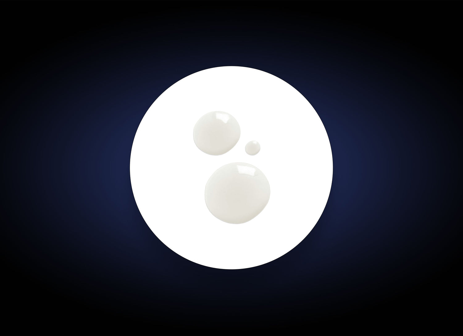 A white circle featuring three smaller white droplets of varying sizes on its surface, positioned against a dark gradient background. The droplets, resembling biodegradable exfoliants in Daily Exfoliant, are placed somewhat asymmetrically within the circle.