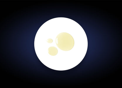 An image shows a dark blue background with an oval white shape in the center. Inside the white oval, there are three irregularly-sized transparent yellow droplets clustered together, reminiscent of Daily Cleansing Oil Makeup Remover used for gentle skin hydration.