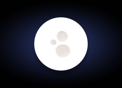 A dark blue background with a bright white circular area in the center, containing three rounded, cream-colored blobs of different sizes arranged in a triangular pattern, reminiscent of Smoothing Toner.