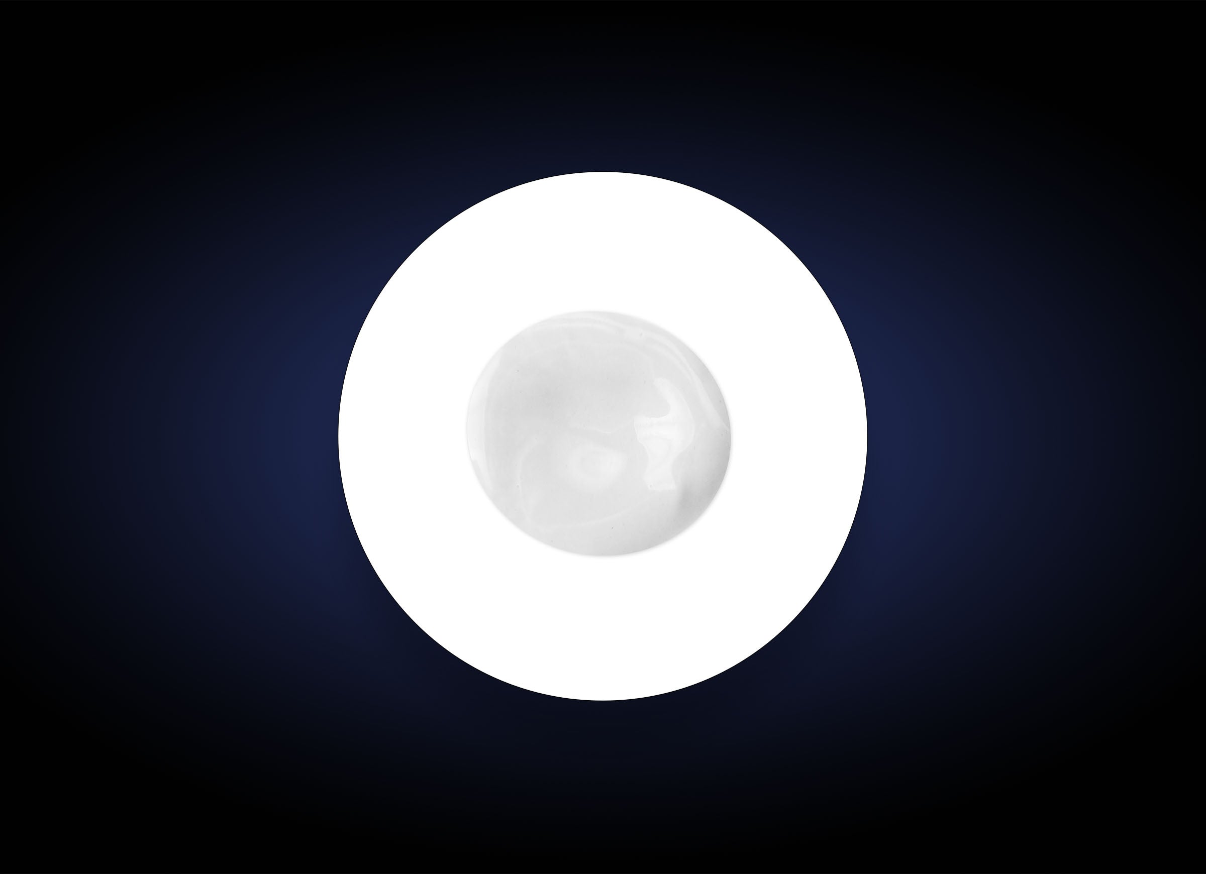 A perfectly round, smooth white object is centered against a dark gradient background. The white object appears glossy and slightly translucent, emanating light that creates a softly diffused halo around it, much like the radiant effect of Daily Defense SPF 50+ designed for optimal protection.