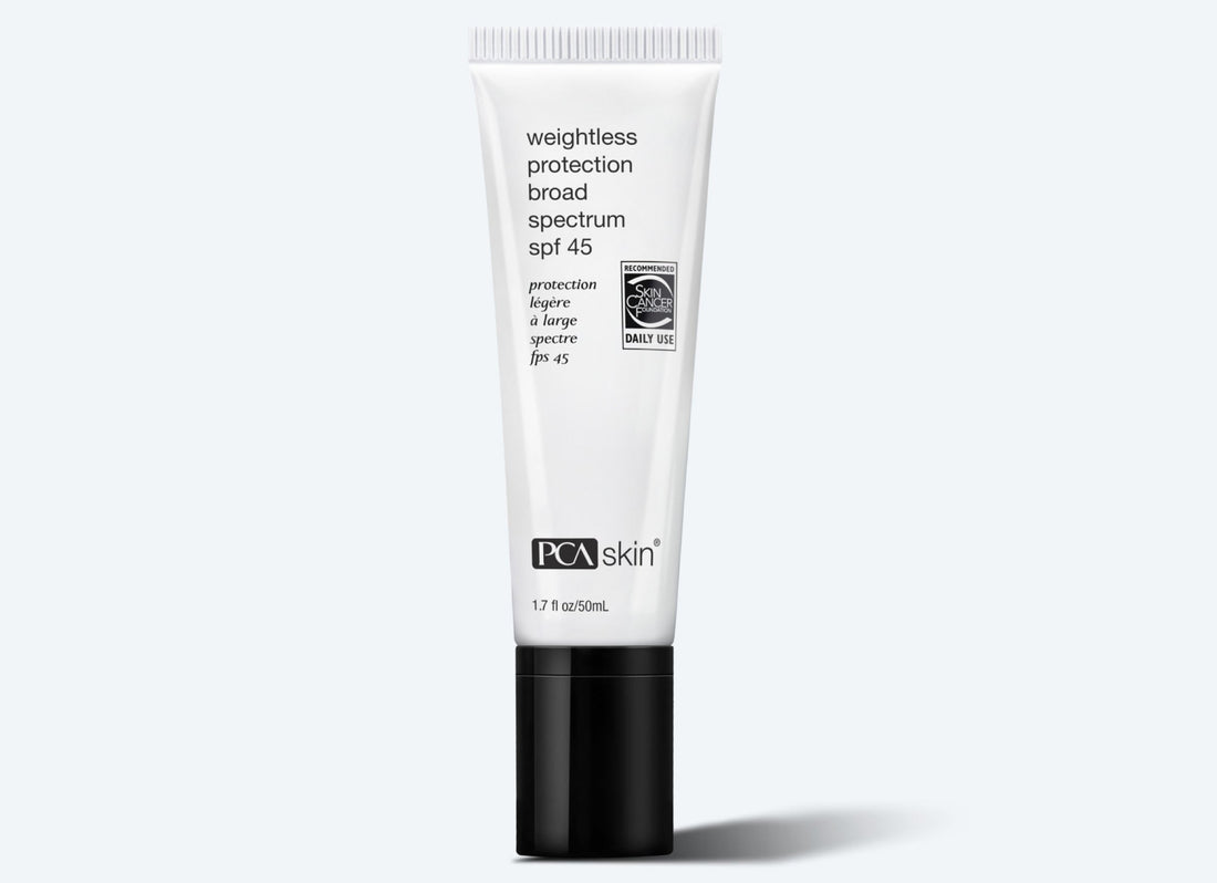 A tube of Weightless Protection BS SPF 45 is displayed against a white background. The white tube features black text and a translucent cap. The label includes a recognition symbol indicating daily use and broad-spectrum protection from UV rays.
