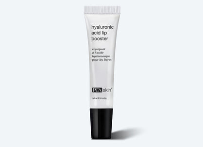 A white tube of Hyaluronic Acid Lip Booster is shown against a white background. The tube features black text and a black cap. The product is described in both English and French, highlighting its role in enhancing collagen production. The net weight of the product is 0.24 oz (7 g).