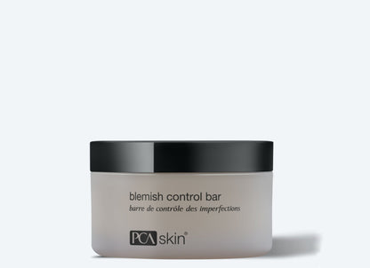 A container of Blemish Control Bar with a black lid. The label, featuring both English and French text, highlights its salicylic acid formulation for treating skin imperfections and acne breakouts. The container sits against a plain, white background.