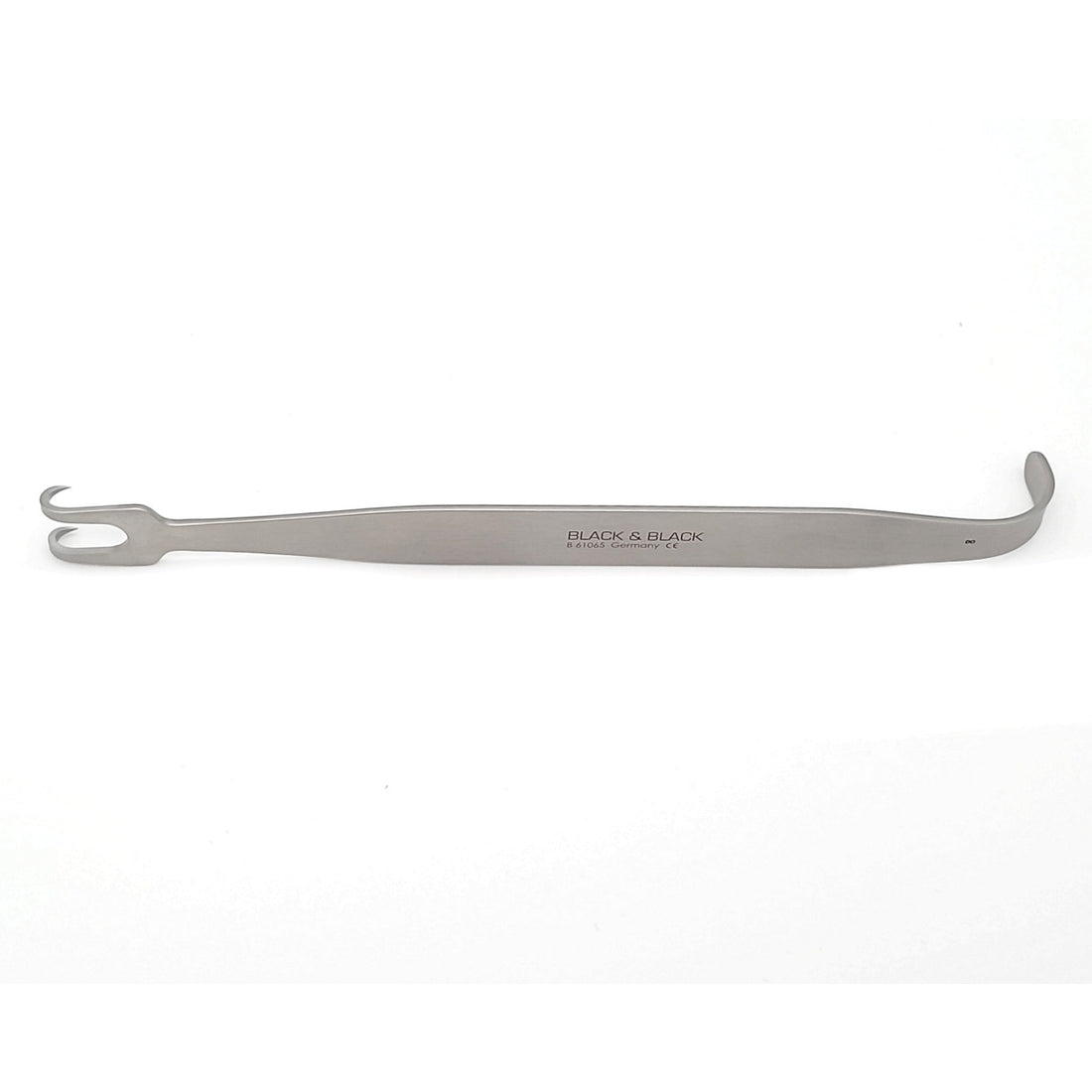 A Nahai Rake Retractor, 7″ (18cm), 2-Prong, 3/4″ (19mm) Wide with a double-ended design, featuring a hook on one end and a small, flat, curved surface on the other. This multi-purpose tool is labeled &quot;BLACK &amp; BLACK SURGICAL&quot; and is placed against a plain white background.