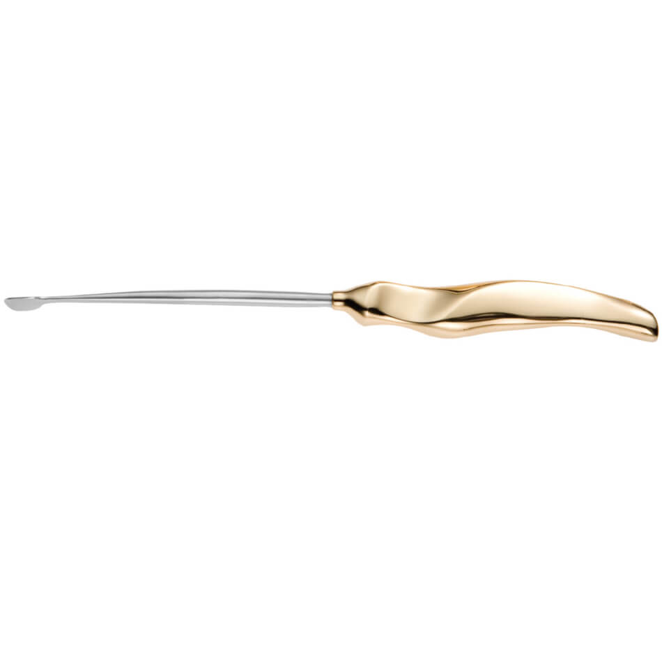 A single earwax removal tool with a sleek, ergonomic, metallic handle, transitioning from gold to silver at the tip. The instrument&