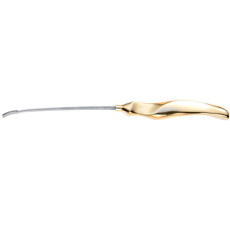 Image of a dental scaler. The tool features a curved, metallic tip attached to a sleek, ergonomic handle that is gold in color. The scaler, akin to Ramirez Endofacelift in its precision, is designed for use in dental procedures to remove plaque and tartar from teeth.