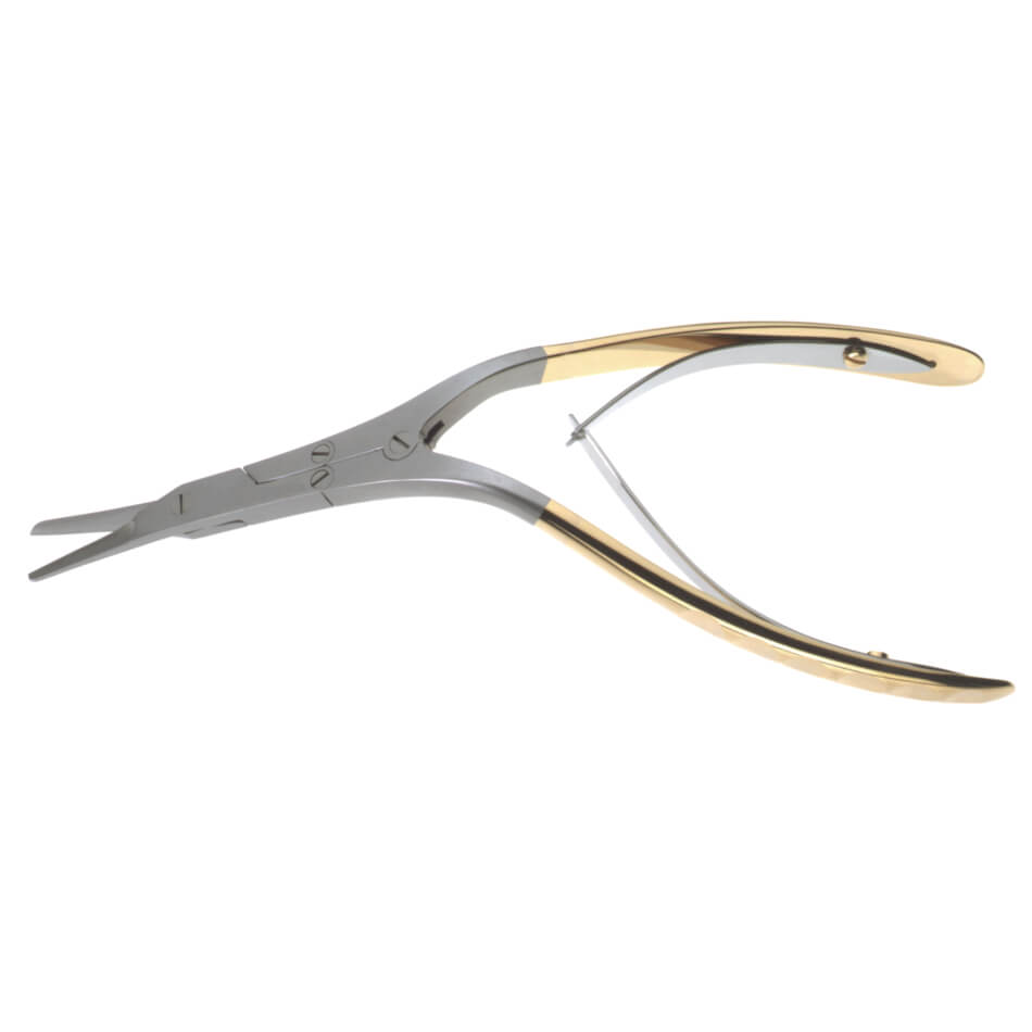 A pair of Caplan Shears Serrated Scissors, 7-3/4″ (19.5cm), Angled with a gold and silver color scheme. Crafted from stainless steel, this instrument features a locking mechanism and fine tips suitable for grasping needles or delicate materials.