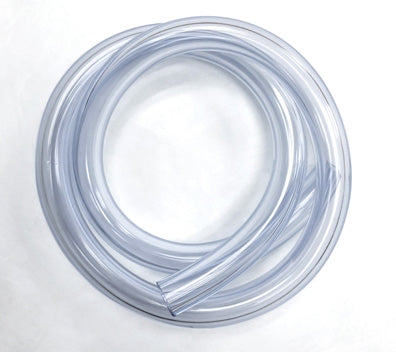 A coiled Filter Connecting Tubing, 30″ (To Cut Pieces As Needed) - Box Of 10 lies on a white surface. The tubing is flexible and forms overlapping loops in a circular shape. The material is translucent, allowing light to pass through but not entirely see through.