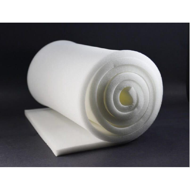 A neatly rolled sheet of white foam is placed on a flat, dark surface with part of the sheet extending out unrolled. The soft and flexible ContourFoam™, 1/2″ x 14″ x 48″ - Box of 4 rolls is suitable for cushioning or insulation purposes, making it ideal for post-operative liposuction foam in compression garments. The background is a plain dark gray.