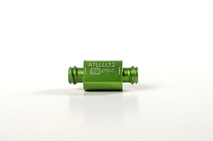 A small green cylindrical electronic component with Luer to Luer connectors on both ends. The component is labeled &quot;Anaerobic &amp; Sizing Transfers™&quot; and has &quot;LOT 2737-C&quot; printed on it. The item, part of the NanoTransfer system, is placed against a white background.