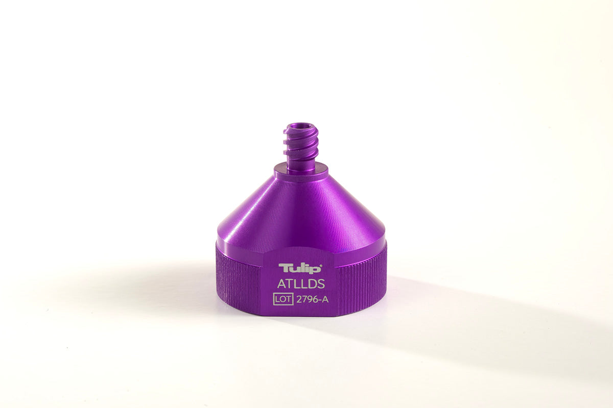 A metallic purple attachment labeled &quot;Decanting Stand™&quot; and &quot;ATLLDS LOT 2796-A&quot; on the front. The cone-shaped device features a screw-like top and a textured bottom edge, designed for precision in tasks like anaerobic transfers. It is placed against a white background.