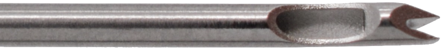 Close-up image of a V Fat Injection Cannula, Luer Lock, Straight with a cylindrical shaft ending in a scoop-like, sharp-edged tip, likely used for precision tasks such as engraving or drilling. The surface is metallic and reflective, indicating it is made of steel or a similar material.