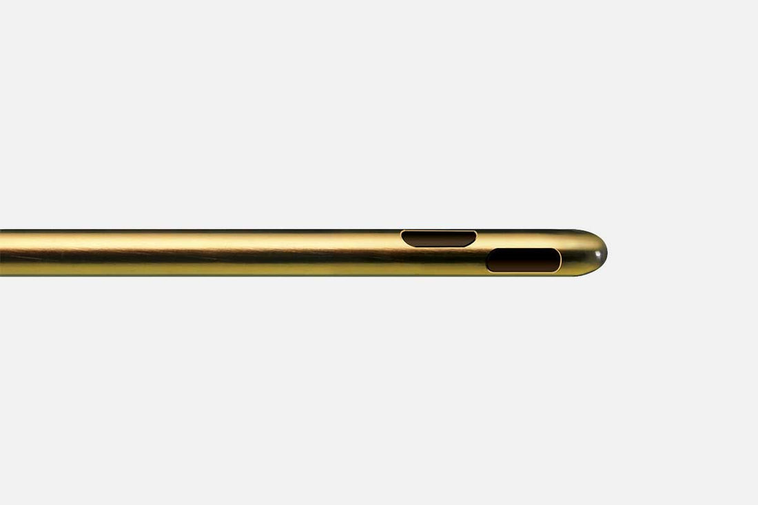 A Carraway Harvester™ - SuperLuerLok™ with two rectangular embouchure holes is shown against a plain white background. The cylindrical metal piece features a spiral three-port design and is smooth and shiny, exhibiting a polished golden hue.