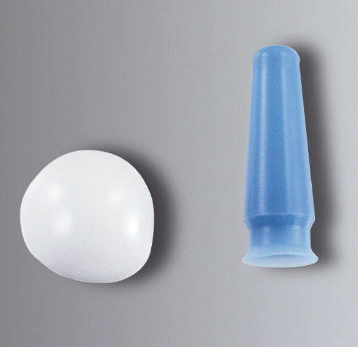 A white spherical object is positioned to the left, next to an Autoclavable Eye Shield with Suction Cup on a plain gray background.