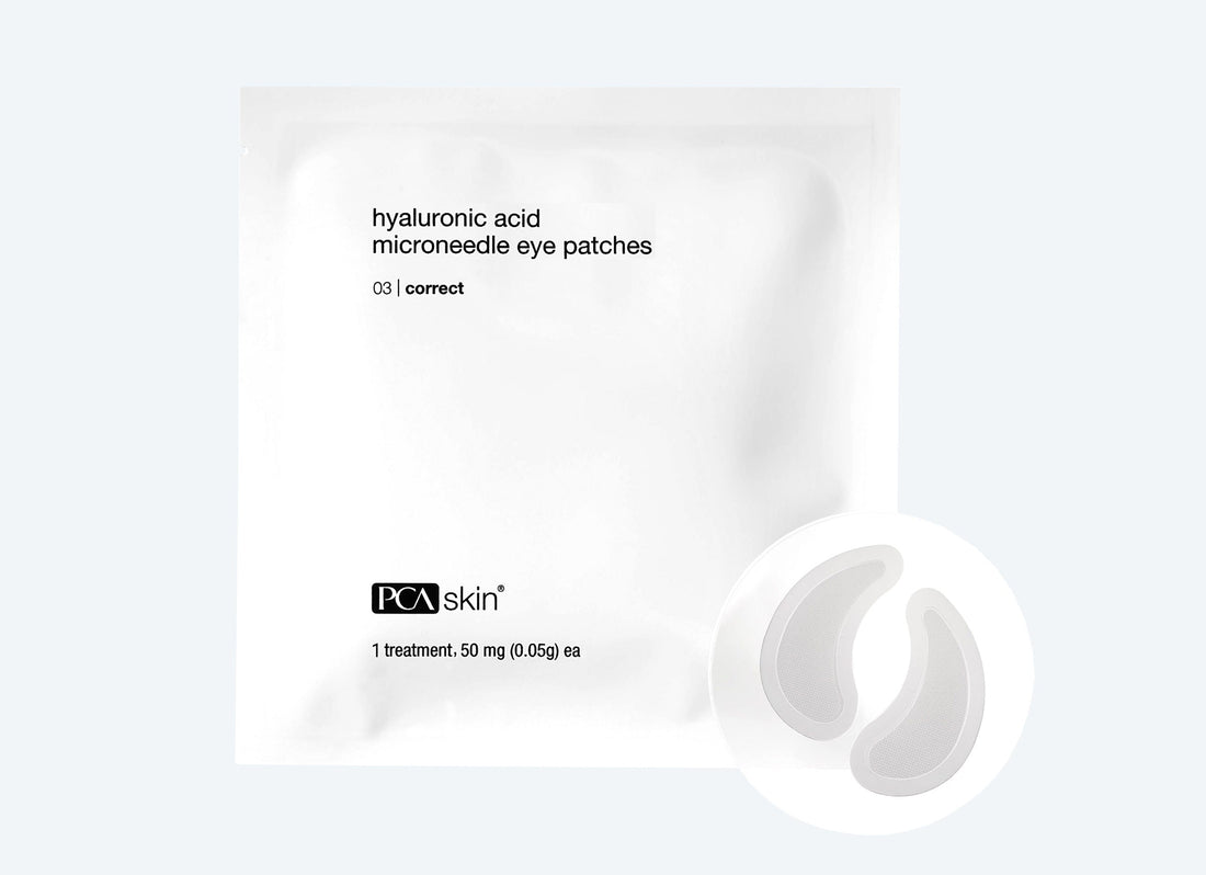 A white package labeled &quot;Hyaluronic Acid Microneedle Eye Patches&quot; with a small black &quot;PCA Skin&quot; logo at the bottom promises anti-aging benefits. The package contains 4 sets. Near the package, two white crescent-shaped eye patches are shown.