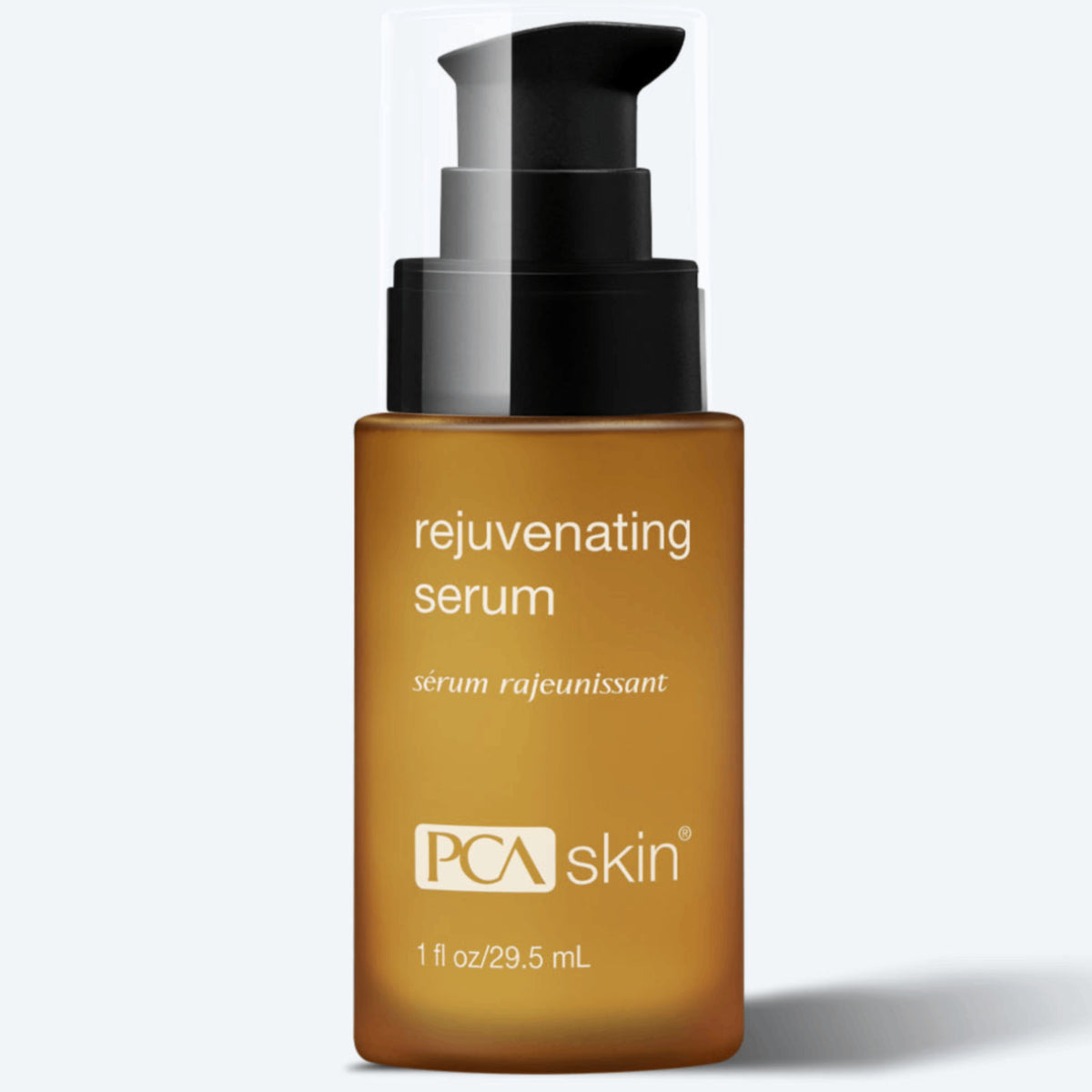 A tan-colored bottle with a black pump dispenser labeled &quot;Rejuvenating Serum&quot; by PCA Skin. The bottle, which also displays &quot;sérum rajeunissant,&quot; contains 1 fl oz/29.5 mL of nourishing serum designed for radiant skin. A transparent cap covers the dispenser.